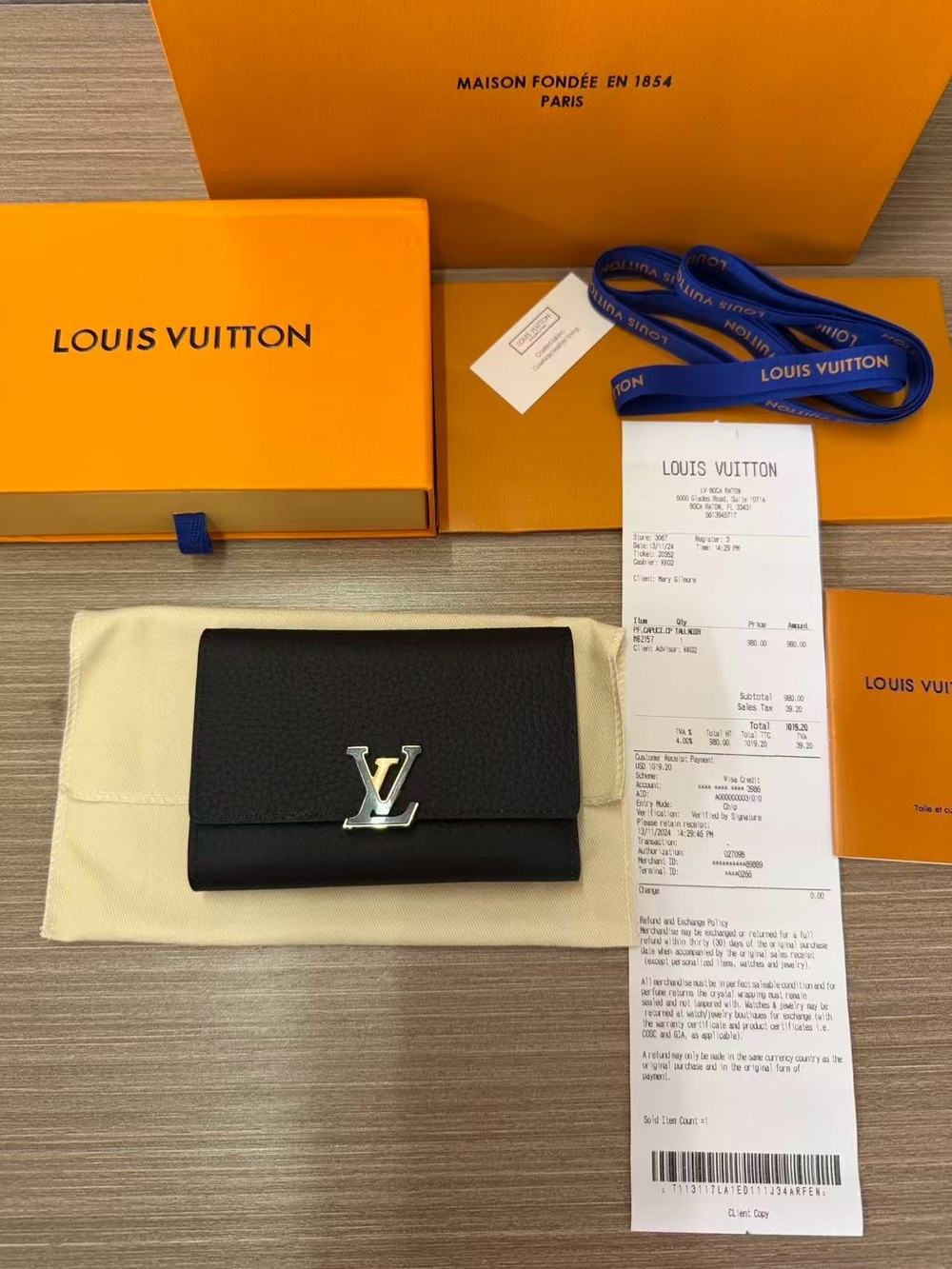 Louis Vuitton Black Leather Compact Wallet with Silver LV Emblem